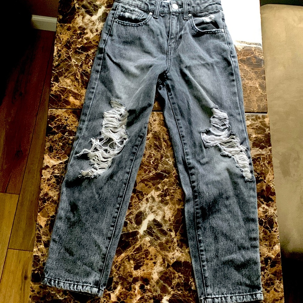 A black pair of jeans, kind of baggy at the end